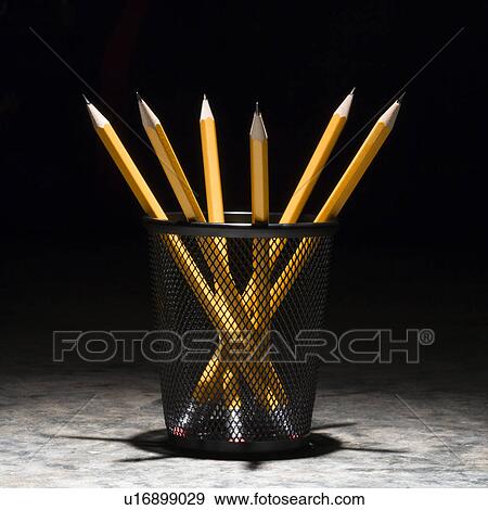 Stock Photo - Group of pencils in a wire mesh pencil holder. Fotosearch