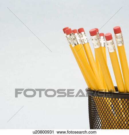 Stock Image - Group of pencils in pencil holder. Fotosearch