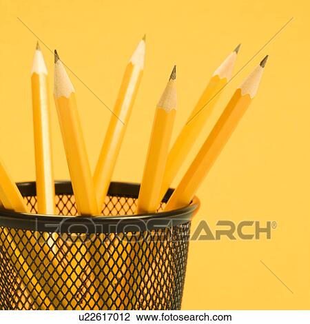 Stock Image - Group of pencils in pencil holder. Fotosearch