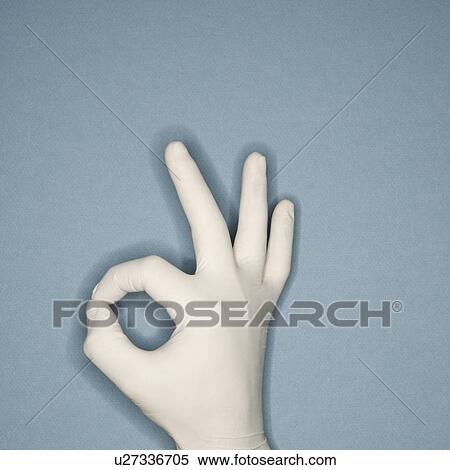 Hand wearing white rubber glove making a gesture meaning okay View Large Photo Image Stock Photography - Hand wearing white rubber glove making a gesture meaning okay. Fotosearch