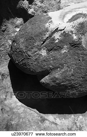 Stock Photo - Large rock on rock cliff in Maui, Hawaii. Fotosearch