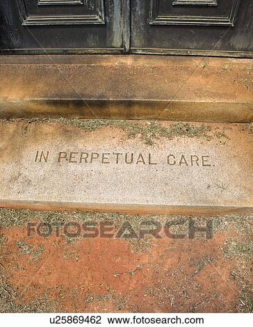 Stock Image - Mausoleum entrance in graveyard with words, 'In Perpetual Care'. Fotosearch