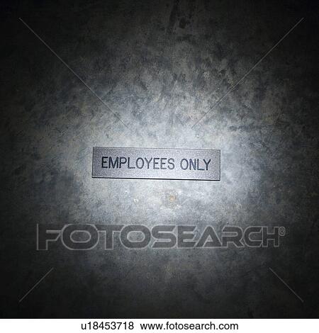 Stock Photo - Metal employees only sign on textured background. Fotosearch