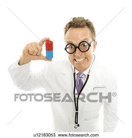 Stock Image - Mid-adult male doctor wearing eyeglasses holding an oversized pill. Fotosearch