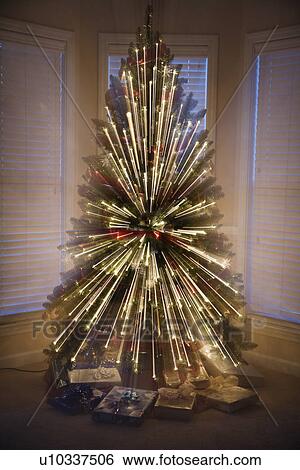 Motion blurred radial abstract Christmas tree lights. View Large Photo Image Stock Photograph - Motion blurred radial abstract Christmas tree lights.. Fotosearch