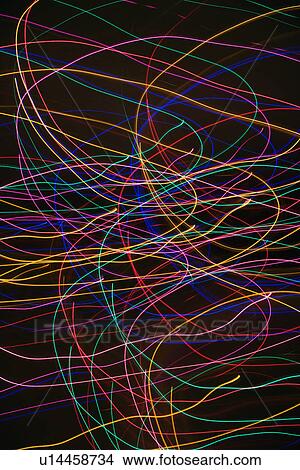 Picture - Multicolored lights forming abstract circular pattern from motion blur.. Fotosearch