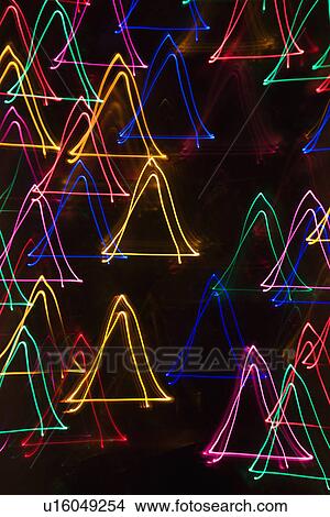 Multicolored lights forming abstract triangle pattern from motion blur View Large Photo Image Picture - Multicolored lights forming abstract triangle pattern from motion blur. Fotosearch