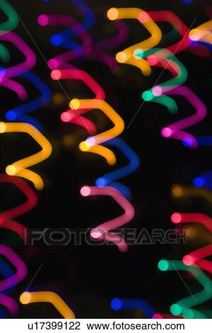 Multicolored lights forming abstract squiggle pattern from motion blur View Large Photo Image Stock Image - Multicolored lights forming abstract squiggle pattern from motion blur. Fotosearch