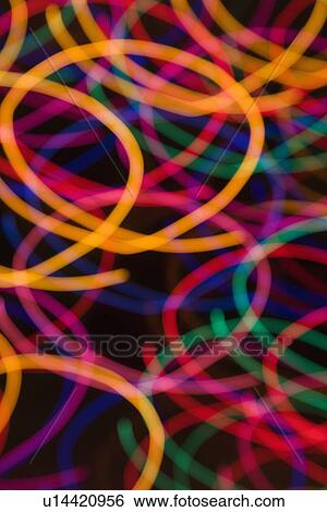 Stock Photograph - Multicolored lights forming abstract circular pattern from motion blur.. Fotosearch