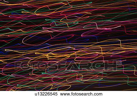 Multicolored lights forming abstract squiggle pattern from motion blur View Large Photo Image Stock Photography - Multicolored lights forming abstract squiggle pattern from motion blur. Fotosearch