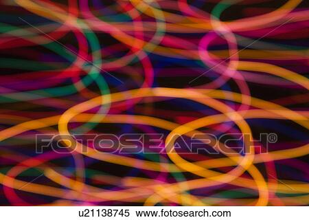 Stock Photography - Multicolored lights forming abstract circular pattern from motion blur. Fotosearch