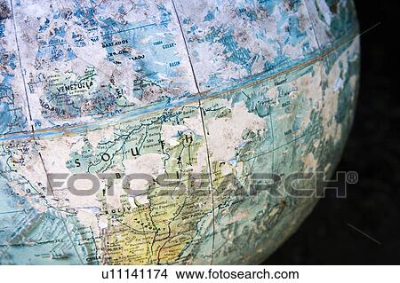 Picture - Old cracked and weathered globe focusing on South America. Fotosearch