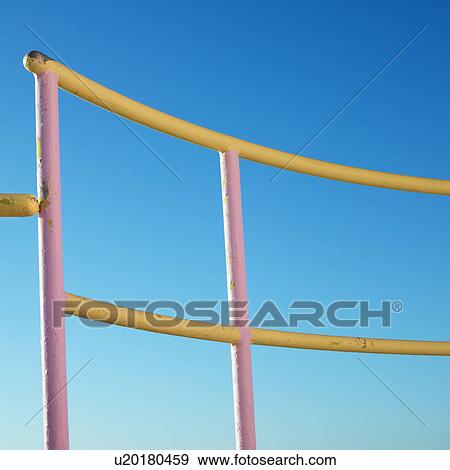 Stock Photo - Pink and yellow painted railings of lifeguard. Fotosearch
