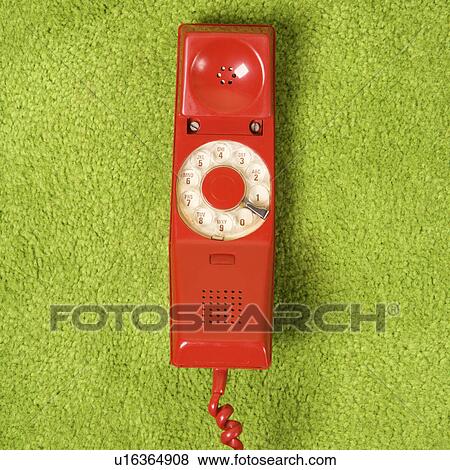 Red vintage rotary telephone receiver laying on 70's green carpet View Large Photo Image Stock Photo - Red vintage rotary telephone receiver laying on 70's green carpet. Fotosearch