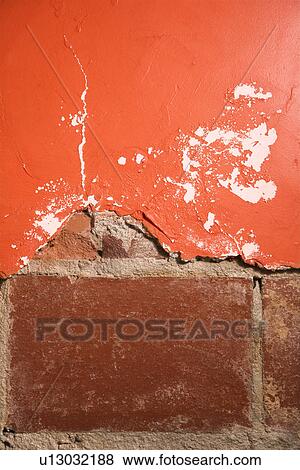 Red wall with cracking plaster and brick View Large Photo Image Stock Photo - Red wall with cracking plaster and brick. Fotosearch