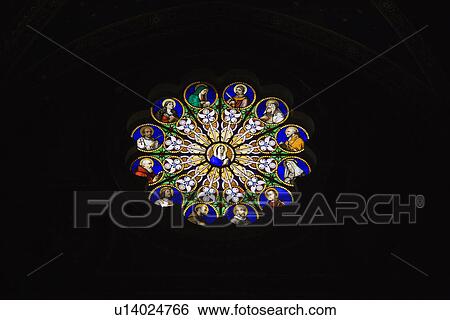 Stock Photograph - Religious themed stained glass window in Rome, Italy.. Fotosearch