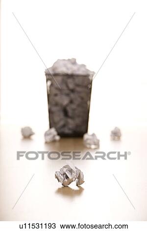 Selective focus of wire mesh trash can with crumpled paper scattered around View Large Photo Image Stock Image - Selective focus of wire mesh trash can with crumpled paper scattered around. Fotosearch