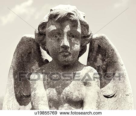 Sepia statue of cherub in graveyard looking at viewer View Large Photo Image Stock Photo - Sepia statue of cherub in graveyard looking at viewer. Fotosearch