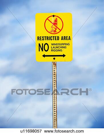 Sign near the ocean or lake warning of no windsurfing, rigging or launching. View Large Photo Image Stock Photo - Sign near the ocean or lake warning of no windsurfing, rigging or launching.. Fotosearch