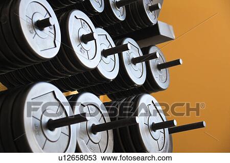 Stacked barbells with weights View Large Photo Image Stock Image - Stacked barbells with weights. Fotosearch
