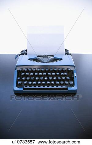 Stock Photo - Still life of blank sheet of paper in an old fashioned typewriter. Fotosearch