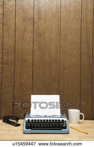 Vintage typewriter, coffee cup, pencil and stapler on desk View Large Photo Image Stock Photo - Vintage typewriter, coffee cup, pencil and stapler on desk. Fotosearch