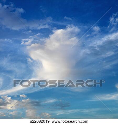 Wispy cloud formations against clear blue sky View Large Photo Image Stock Photo - Wispy cloud formations against clear blue sky. Fotosearch