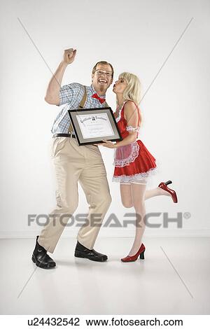 Young man dressed like nerd cheering and receiving kiss and certificate from young blonde woman dressed in french maid outfit View Large Photo Image Stock Image - Young man dressed like nerd cheering and receiving kiss and certificate from young blonde woman dressed in french maid outfit. Fotosearch