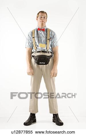 Stock Photography - Young man dressed like nerd looking at viewer. Fotosearch