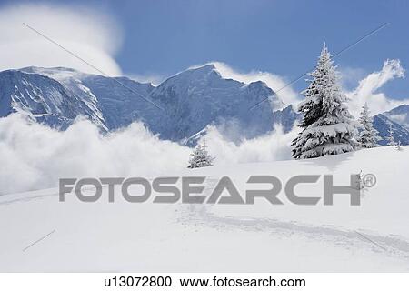 Stock Image - Footprints through fresh snow. Fotosearch