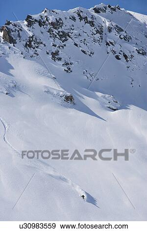 Skier carving through powder snow View Large Photo Image Stock Photo - Skier carving through powder snow. Fotosearch