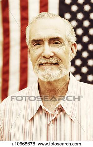 Close-up of a mature man smiling View Large Photo Image Stock Photo - Close-up of a mature man smiling. Fotosearch