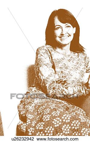 Stock Image - Close-up of a mature woman sitting in an armchair and smiling. Fotosearch