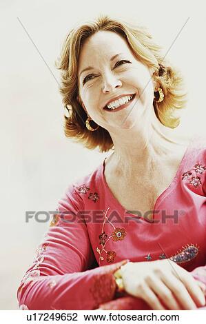 Stock Image - Close-up of a mature woman smiling. Fotosearch