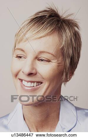 Stock Photo - Close-up of a mature woman smiling. Fotosearch