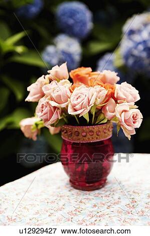 Close-up of roses in a flower vase View Large Photo Image Stock Photo - Close-up of roses in a flower vase. Fotosearch