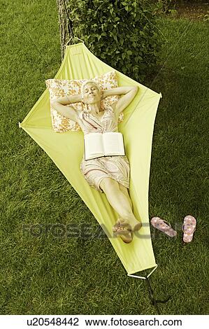 High angle view of a senior woman lying in a hammock View Large Photo Image Stock Image - High angle view of a senior woman lying in a hammock. Fotosearch
