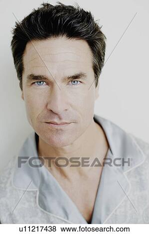 Stock Photo - Portrait of a mature man looking serious. Fotosearch