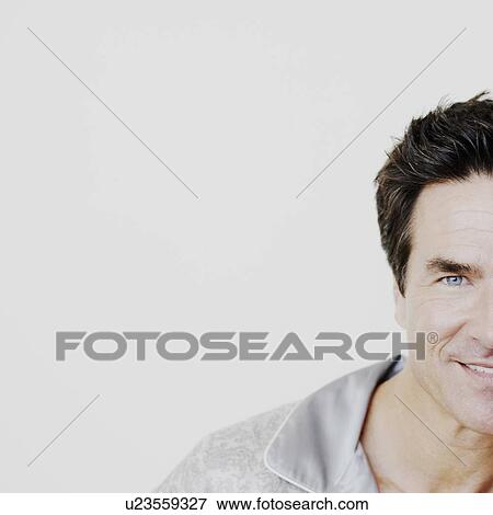 Portrait of a mature man smiling View Large Photo Image Stock Photo - Portrait of a mature man smiling. Fotosearch