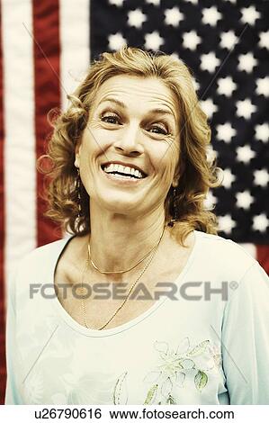 Portrait of a mature woman smiling View Large Photo Image Stock Photograph - Portrait of a mature woman smiling. Fotosearch