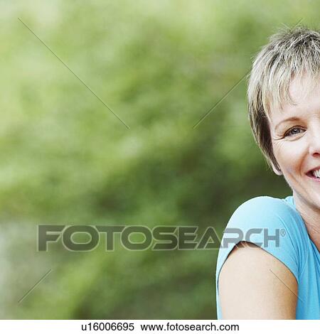 Portrait of a mature woman smiling View Large Photo Image Stock Photography - Portrait of a mature woman smiling. Fotosearch