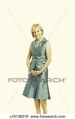 Portrait of a mature woman standing View Large Photo Image Stock Photograph - Portrait of a mature woman standing. Fotosearch