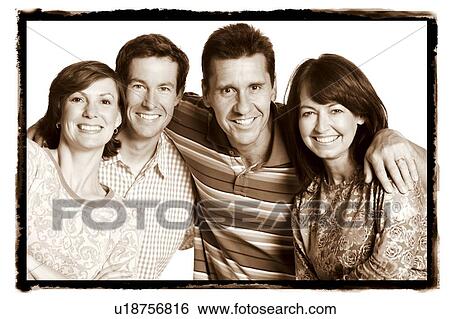 Portrait of a mid adult couple and a mature couple posing and smiling View Large Photo Image Stock Photograph - Portrait of a mid adult couple and a mature couple posing and smiling. Fotosearch