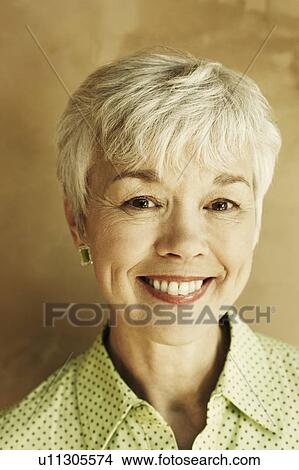 Portrait of a senior woman smiling View Large Photo Image Picture - Portrait of a senior woman smiling. Fotosearch