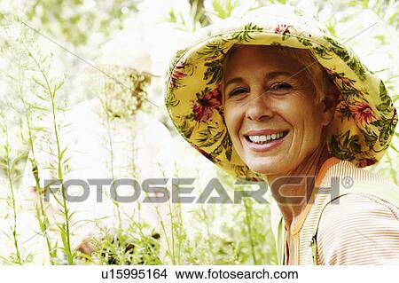 Portrait of a senior woman smiling View Large Photo Image Picture - Portrait of a senior woman smiling. Fotosearch
