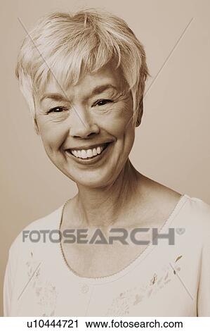 Portrait of a senior woman smiling View Large Photo Image Stock Image - Portrait of a senior woman smiling. Fotosearch