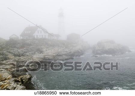Stock Image - Fog shrouds the Lighthouse. Fotosearch