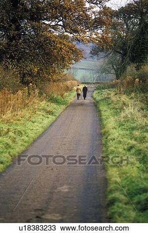 Stock Image - Walking in the English countryside. Fotosearch