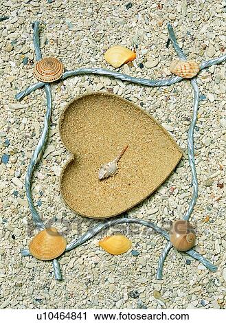 Stock Image - rim, frame, heart-shaped, seashell, stone. Fotosearch
