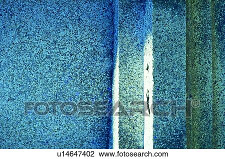 Stock Image - wall, grindstone, yard, garden. Fotosearch